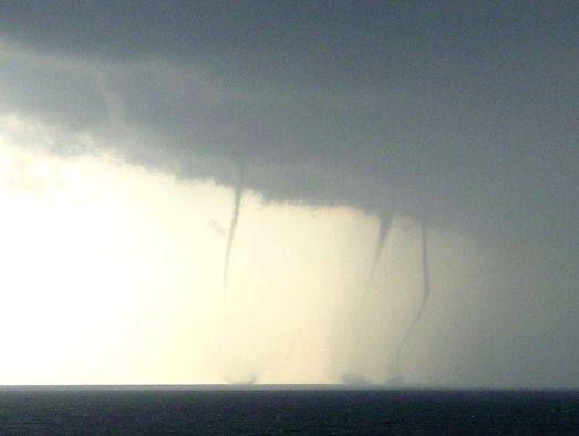 Waterspouts on the beach of Kijkduin near The Hague, the Netherlands on 2006 August 27.  Photo by Skatebiker, released into public domain & available on Wikipedia.
