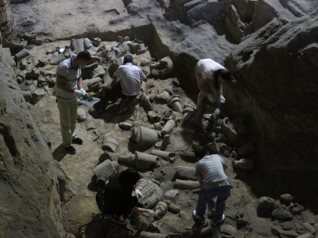 Workers uncovering new figures in Pit 2.