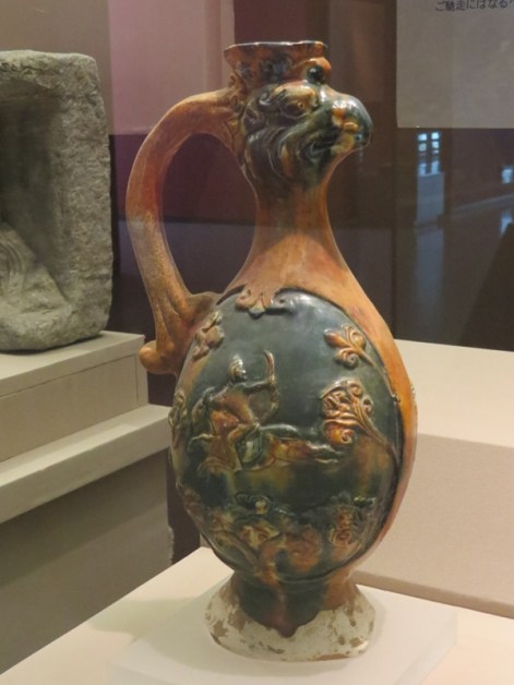 Tri-color pot with a phoenix head.